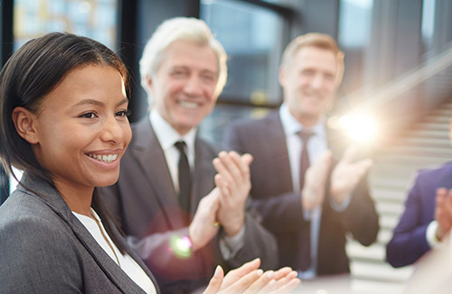 Three people applauding